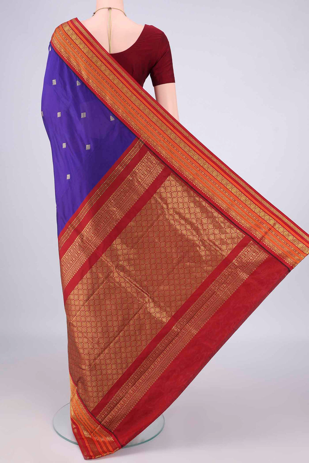 Flat view of Navy Blue Blended Bangalore Silk Saree with Zari Butta on the body and Zari Border. 