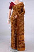 Pure Silk Mustard Printed Saree with Printed design on the body and Printed Border.  displayed on a mannequin
