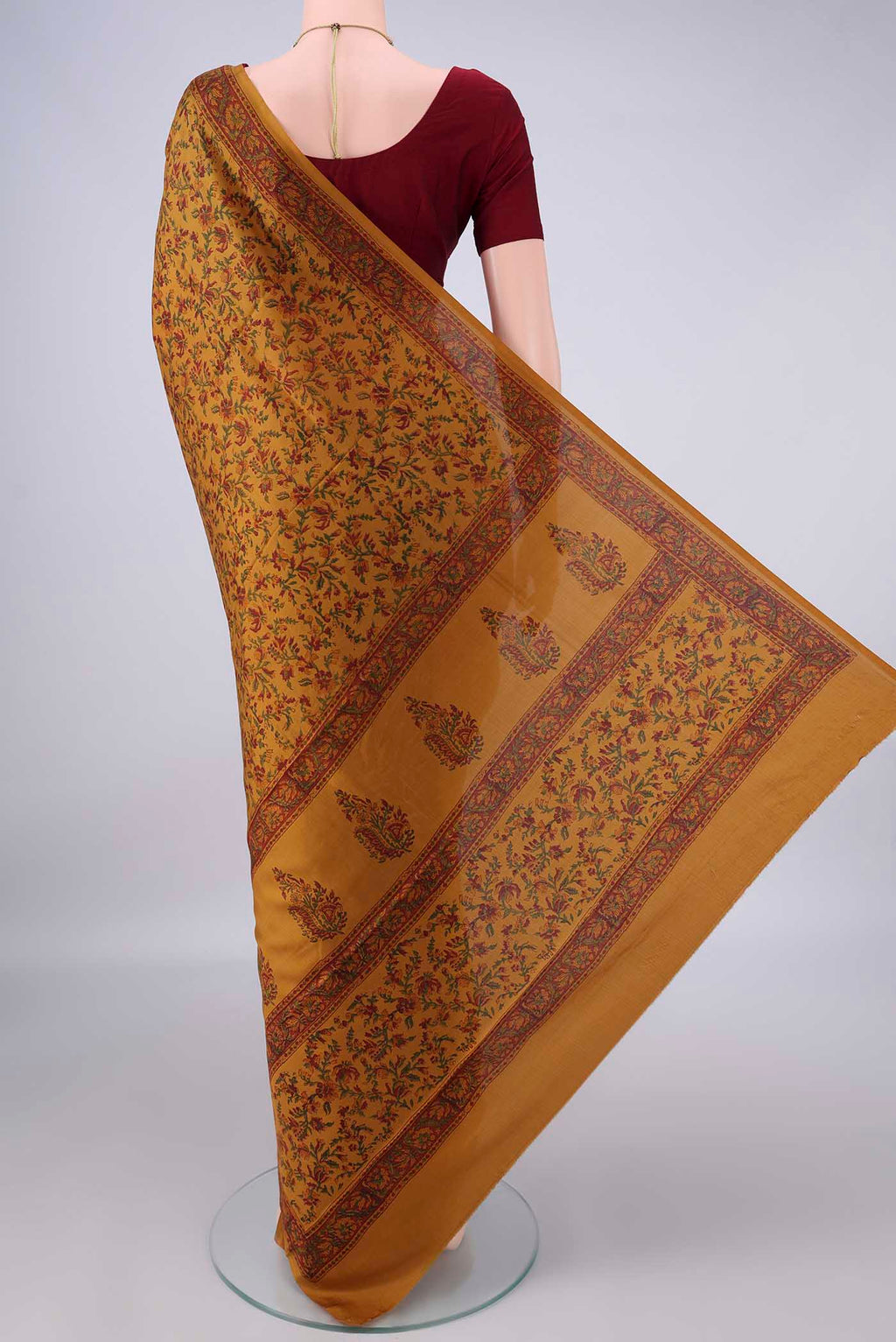Flat view of Pure Silk Mustard Printed Saree with Printed design on the body and Printed Border. 