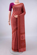 Pure Silk Coral Printed Saree with Printed design on the body and Printed Border.  displayed on a mannequin