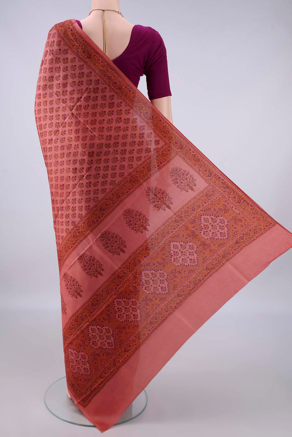 Flat view of Pure Silk Coral Printed Saree with Printed design on the body and Printed Border. 