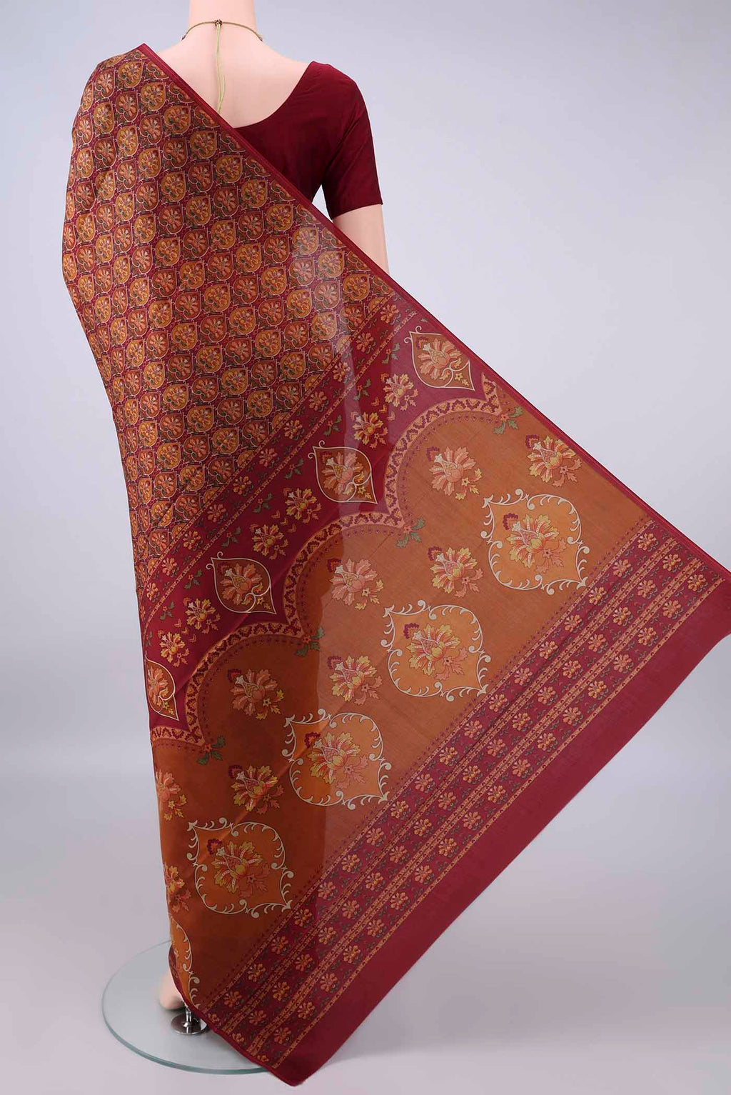 Flat view of Pure Silk Rust Printed Saree with Printed design on the body and Printed Border. 