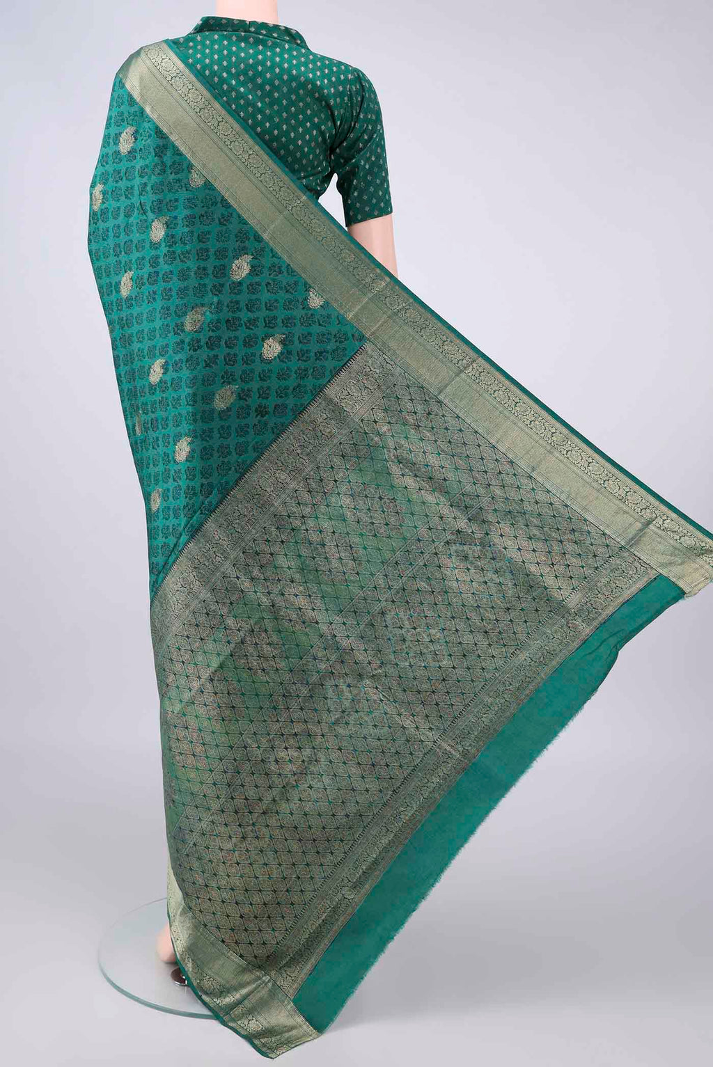 Flat view of Pure Silk Sea Green Printed Saree with Printed design on the body and Zari Border. 