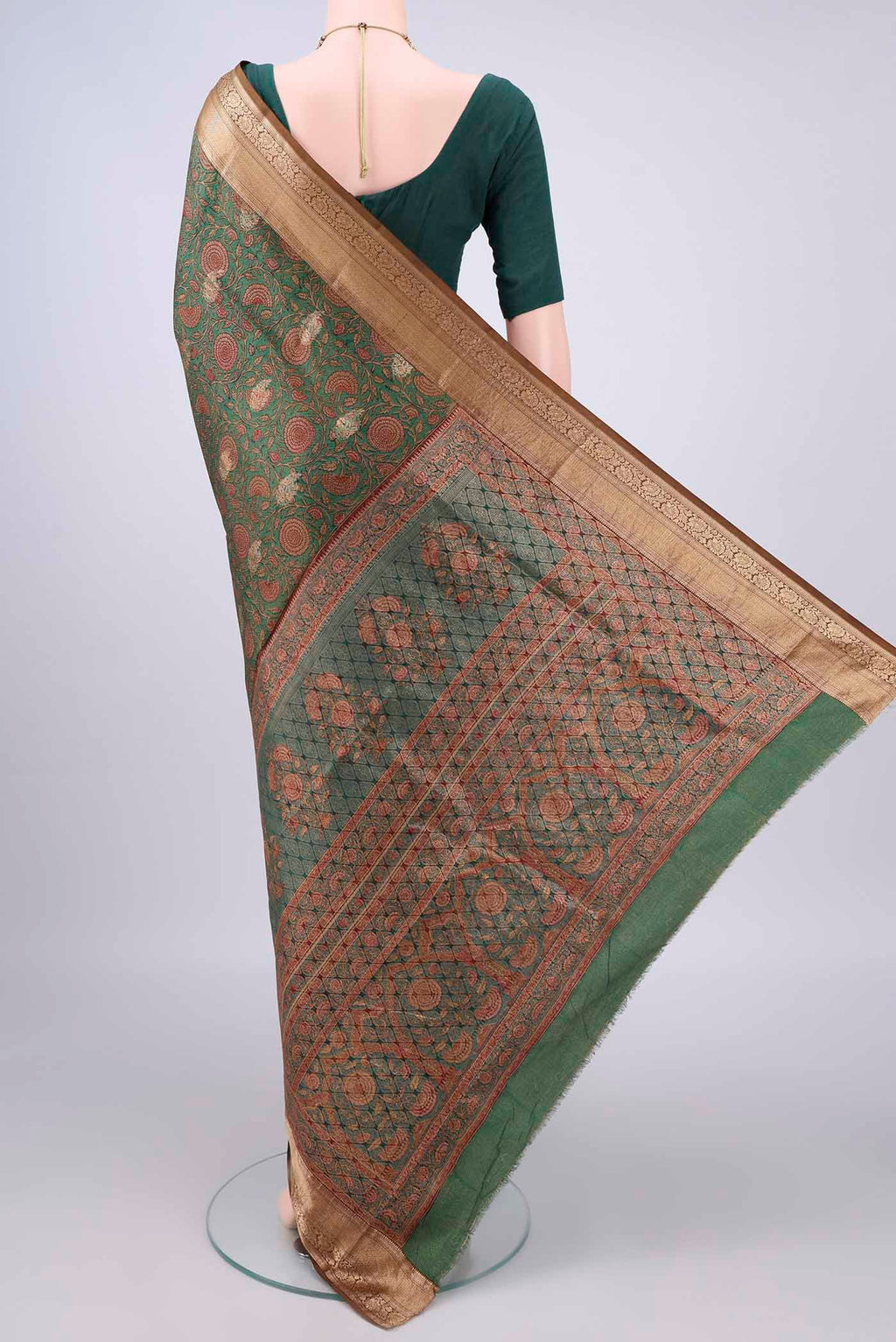 Flat view of Pure Silk Green Printed Saree with Printed design on the body and Zari Border. 