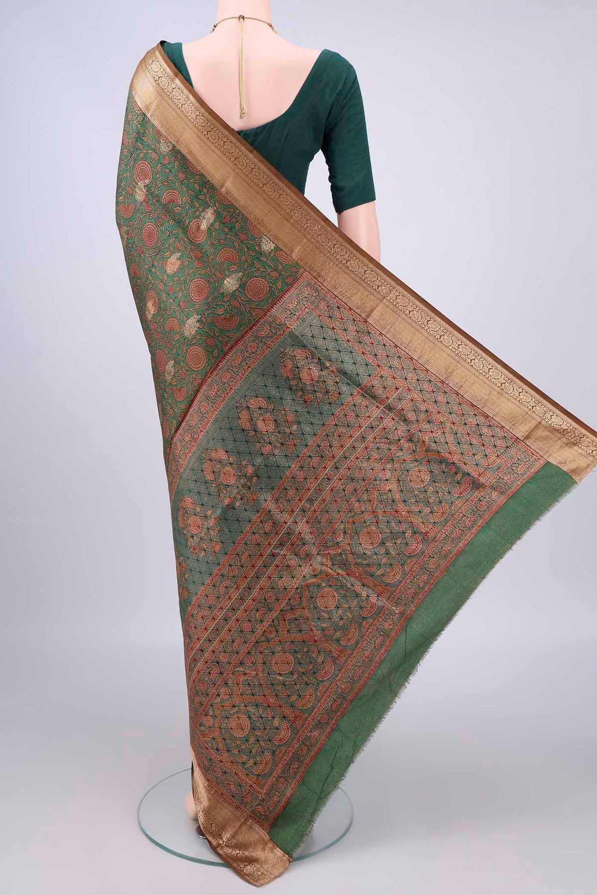 Flat view of Pure Silk Green Printed Saree with Printed design on the body and Zari Border. 