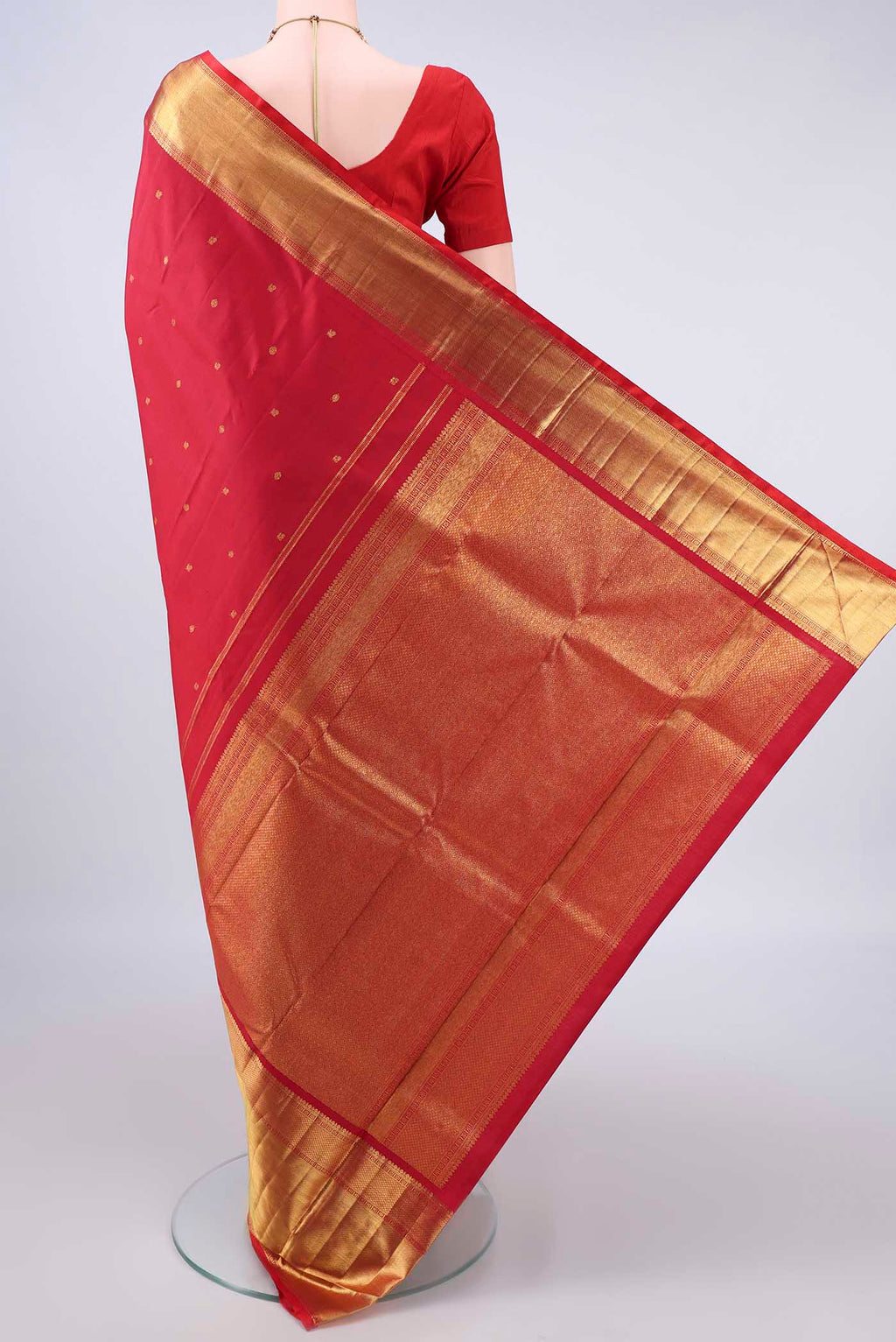 Flat view of Pure Silk Red Kanchipuram Saree with Zari Butta on the body and Zari Border. 