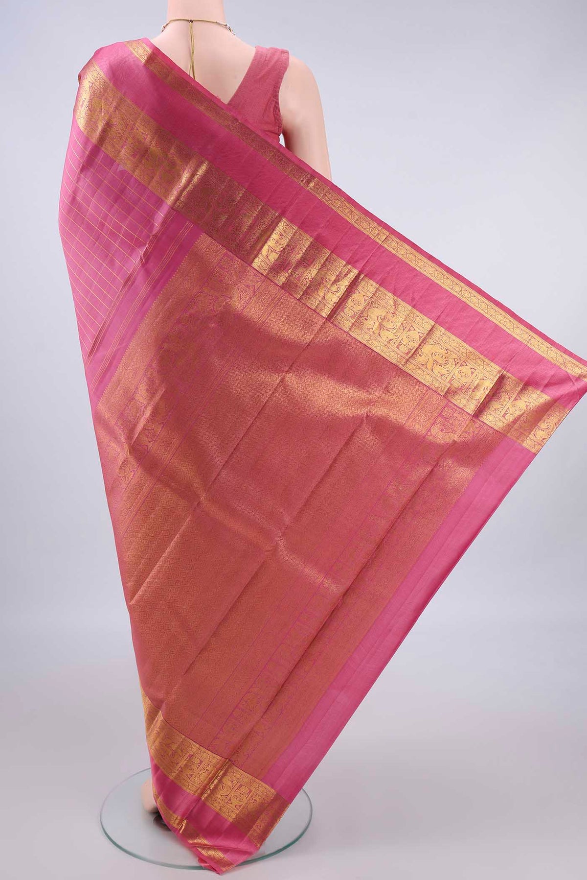 Flat view of Pure Silk Pink Kanchipuram Saree with Checked design on the body and Zari Border. 