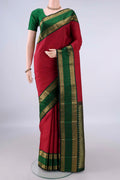 Pure Silk Deep Red Kanchipuram Saree with Stripes on the body and Zari Border.  displayed on a mannequin