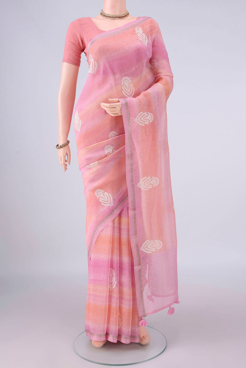 Rose pink Dual Tone Linen Saree with Floral Print on the body and Zari Border.  displayed on a mannequin