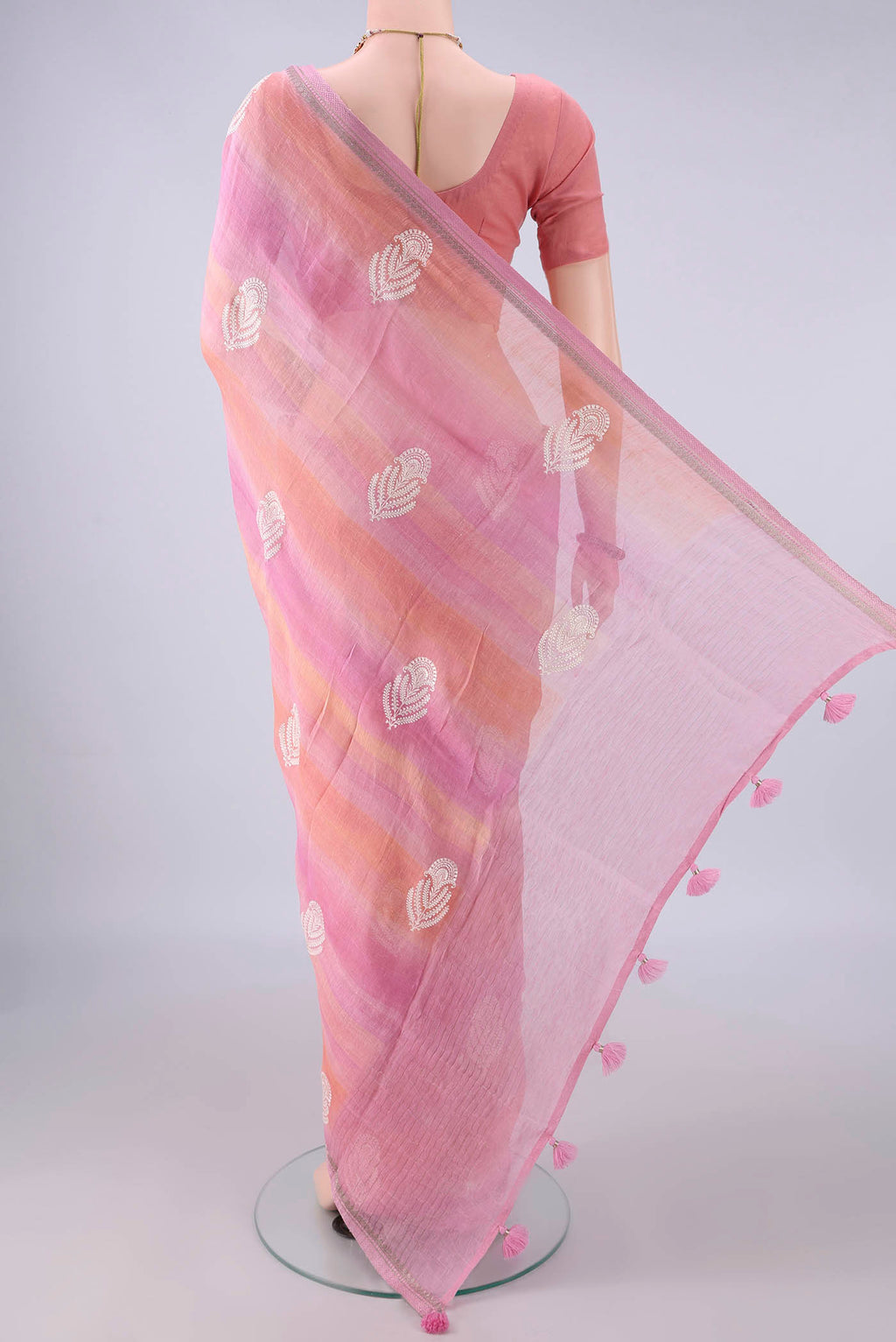 Flat view of Rose pink Dual Tone Linen Saree with Floral Print on the body and Zari Border. 