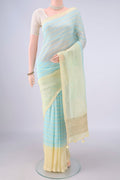 Sky Blue Linen Saree with Floral Print on the body and Without Border.  displayed on a mannequin