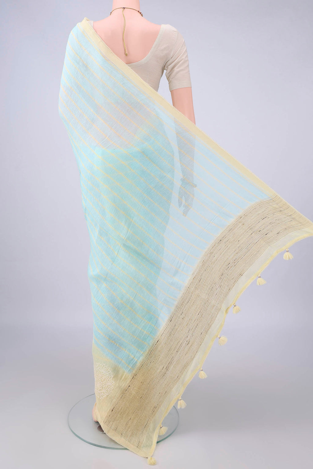 Flat view of Sky Blue Linen Saree with Floral Print on the body and Without Border. 