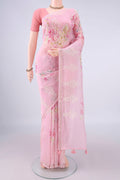 Rose pink Linen Saree with Floral Print on the body and Zari Border.  displayed on a mannequin