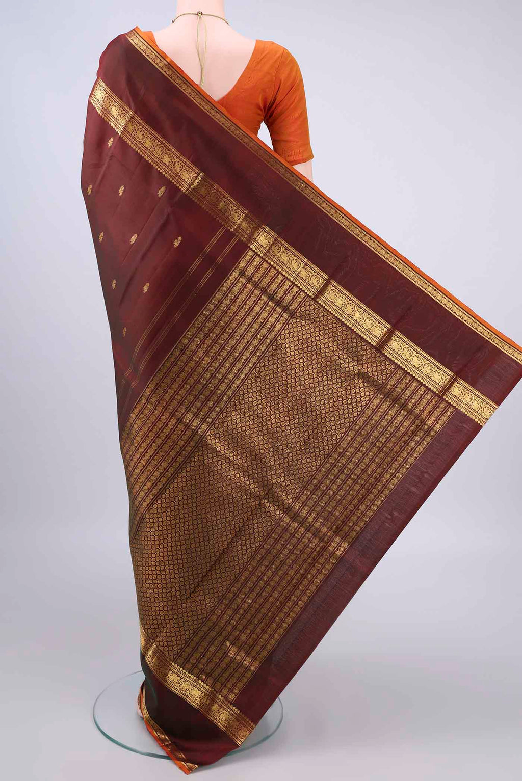 Flat view of Pure Silk Brown Dual Tone Kanjivaram Saree with Zari Butta on the body and Zari Border. 