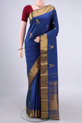 Pure Silk Royal Blue Kanjivaram Saree with Zari Butta on the body and Zari Border.  displayed on a mannequin