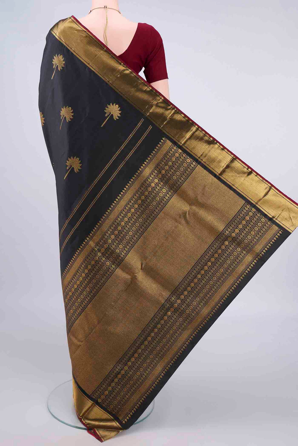 Flat view of Pure Silk Black Kanjivaram Saree with Zari Butta on the body and Zari Border. 