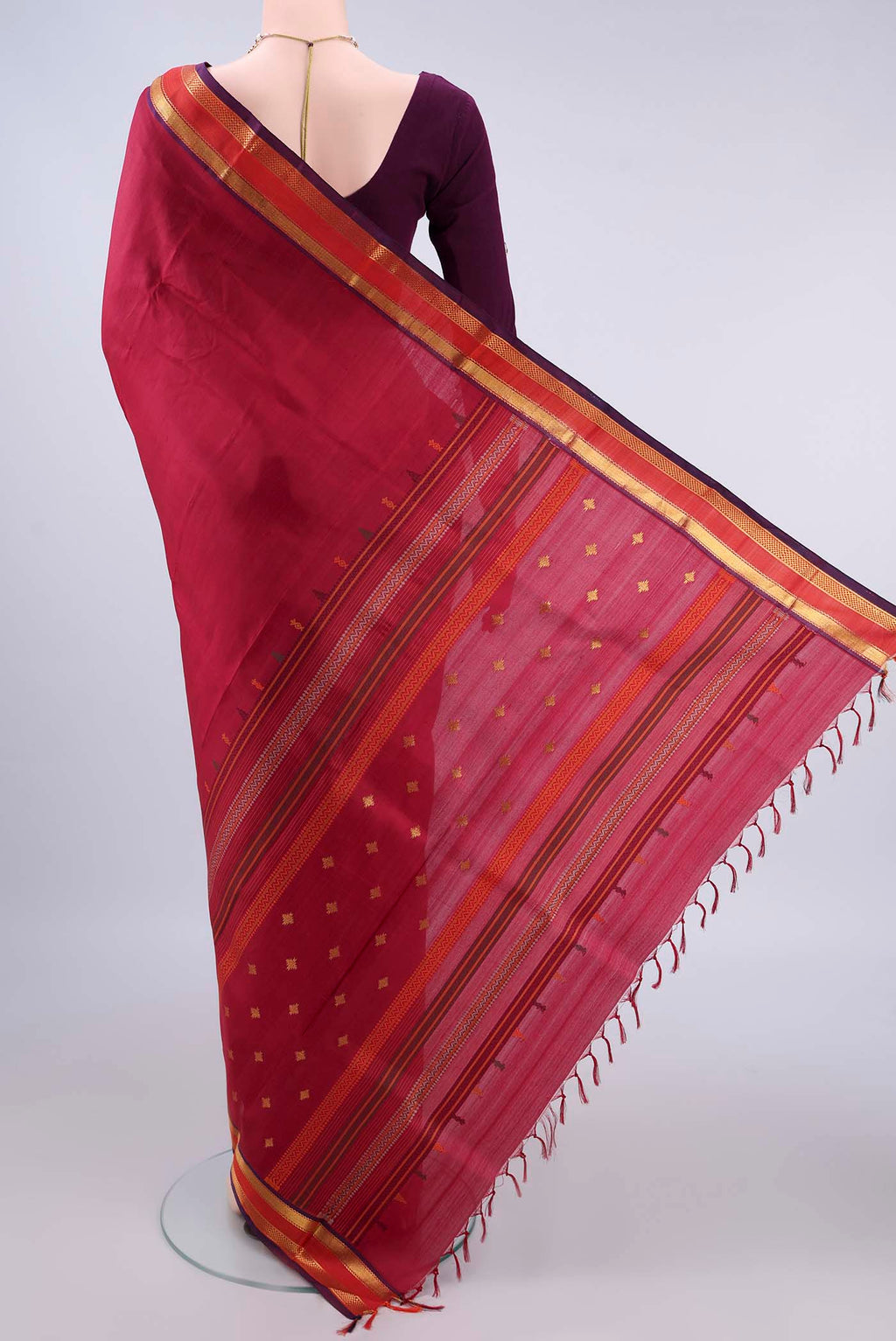 Flat view of Pure Silk Red Kanchipuram Saree with Plain Body and Zari Border. 
