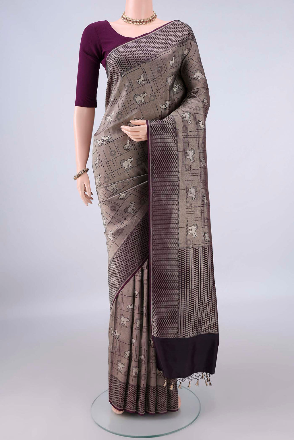 Pure Silk Grey Banarasi Saree with Zari Butta on the body and Zari Border.  displayed on a mannequin