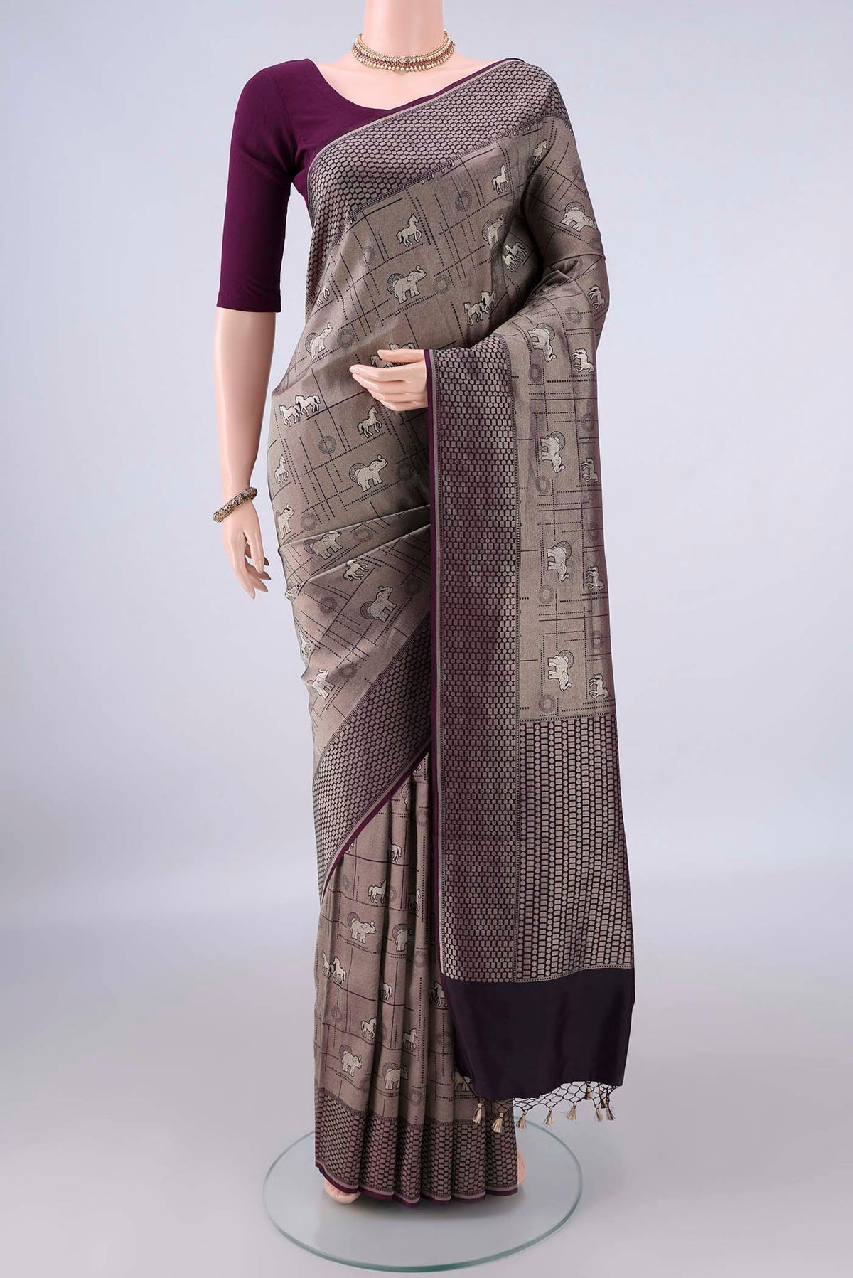 Pure Silk Grey Banarasi Saree with Zari Butta on the body and Zari Border.  displayed on a mannequin