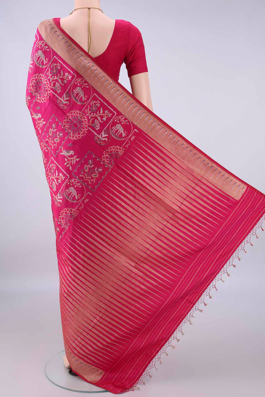 Flat view of Pure Silk Rani Pink Banarasi Saree with Zari Butta on the body and Zari Border. 