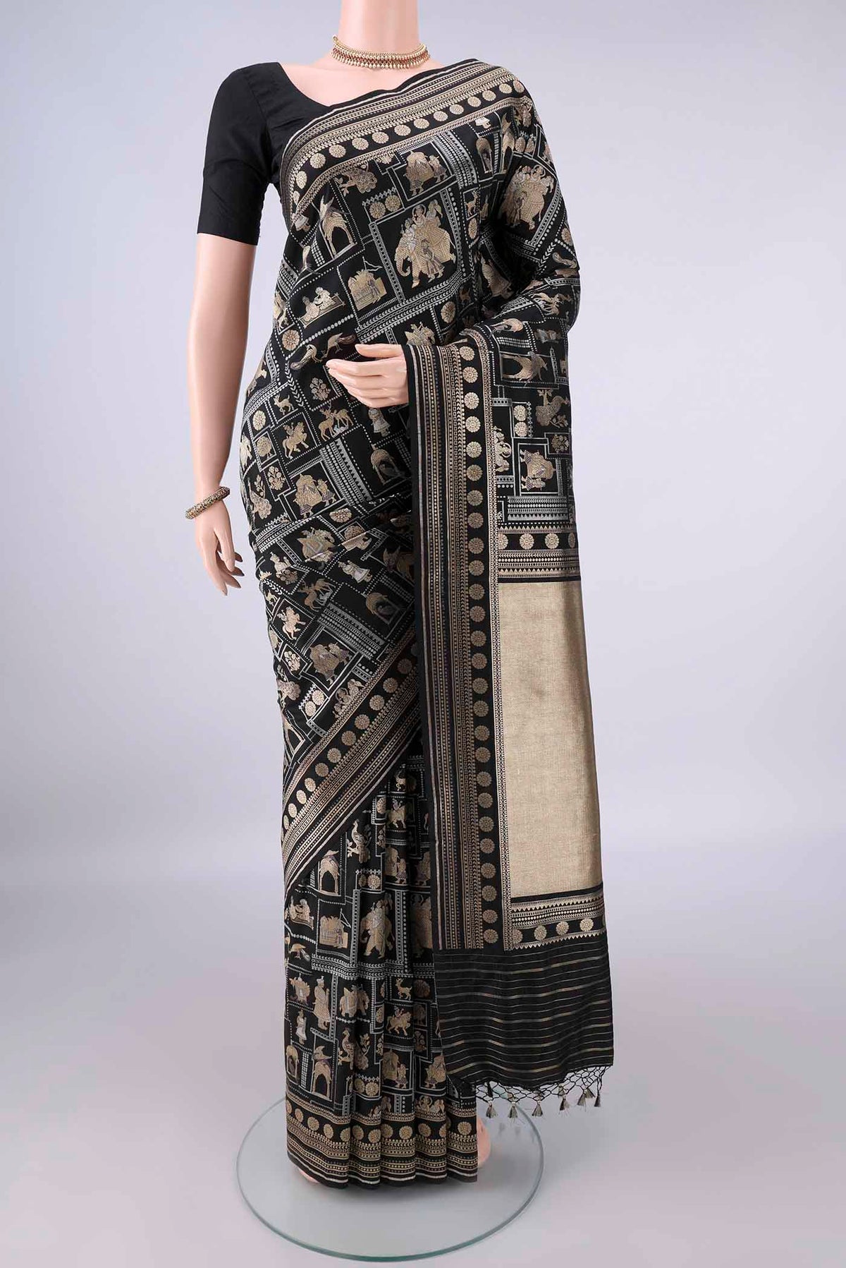 Pure Silk Black Banarasi Saree with Zari Butta on the body and Zari Border.  displayed on a mannequin