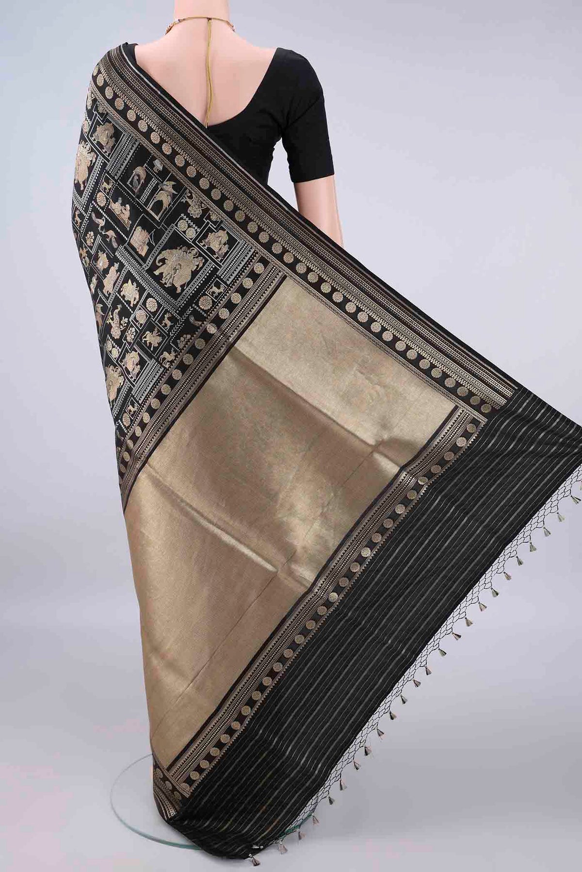 Flat view of Pure Silk Black Banarasi Saree with Zari Butta on the body and Zari Border. 