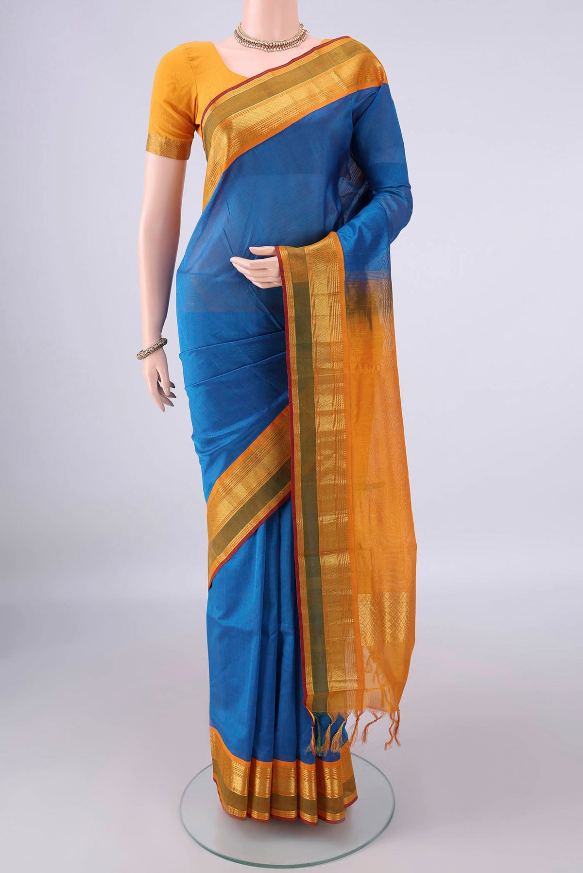 Blue Silk Cotton Saree with Plain Body and Zari Border.  displayed on a mannequin