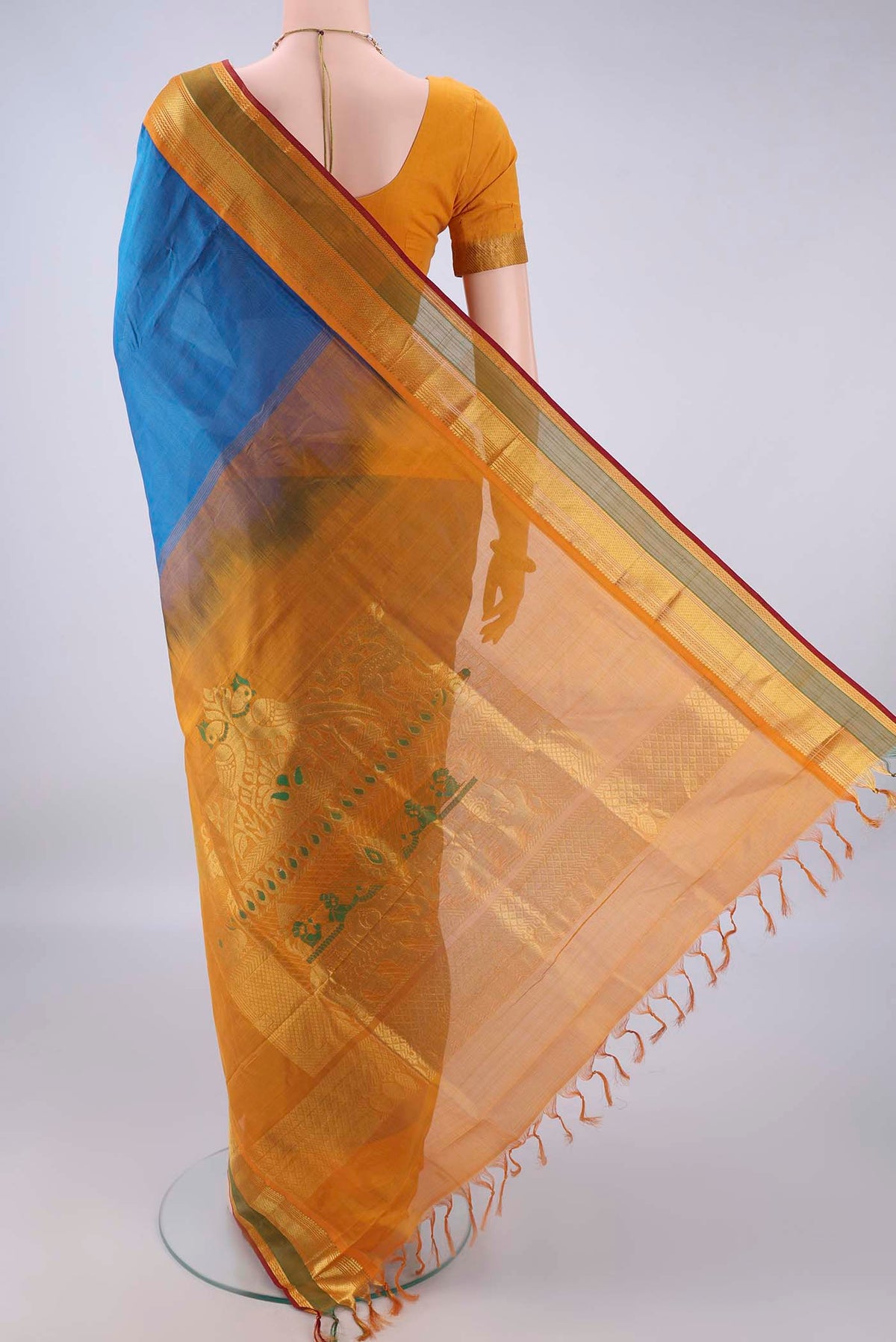 Flat view of Blue Silk Cotton Saree with Plain Body and Zari Border. 