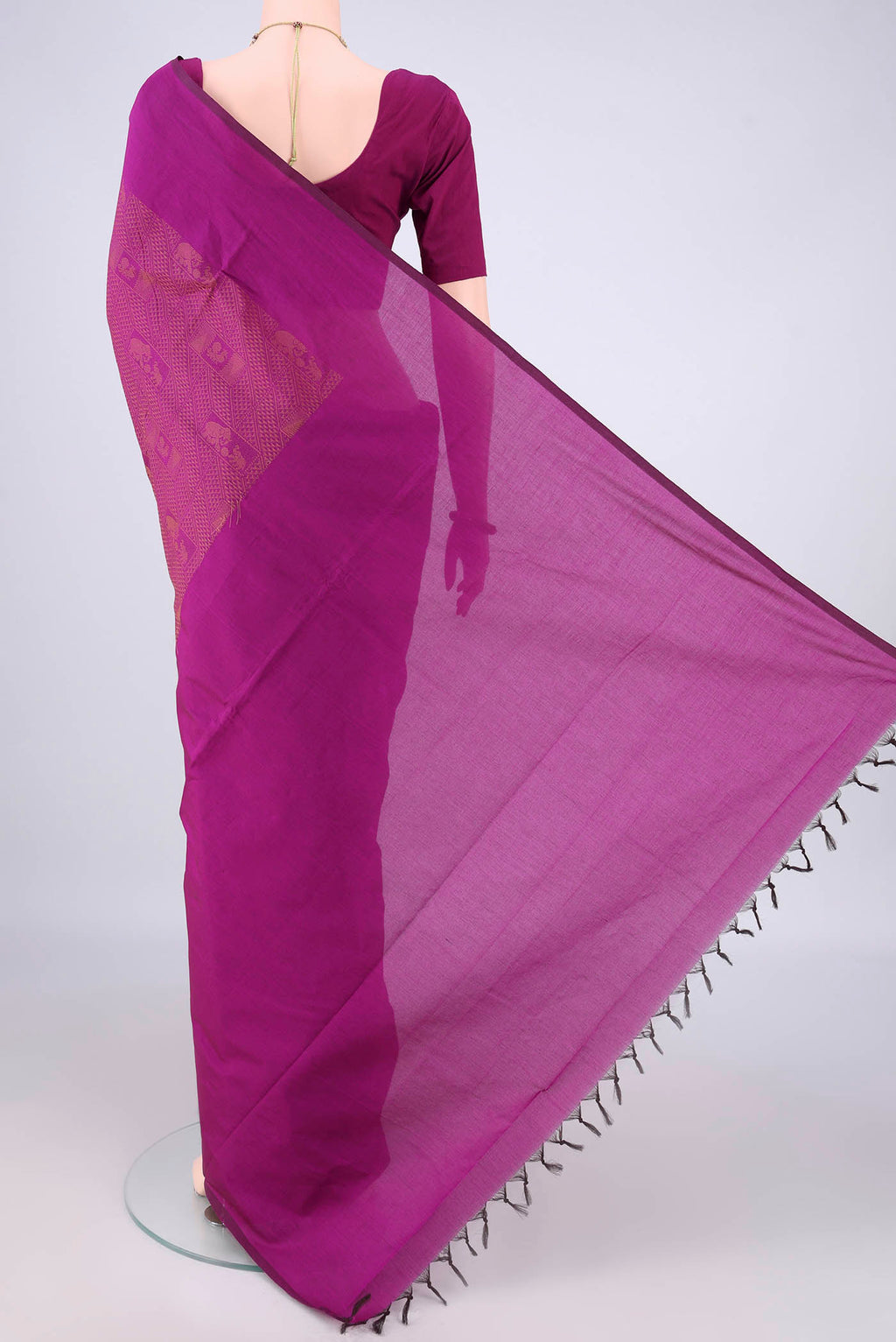 Flat view of Magenta Blended Poly Cotton Saree with Jacquard design on the body and Thread Border. 