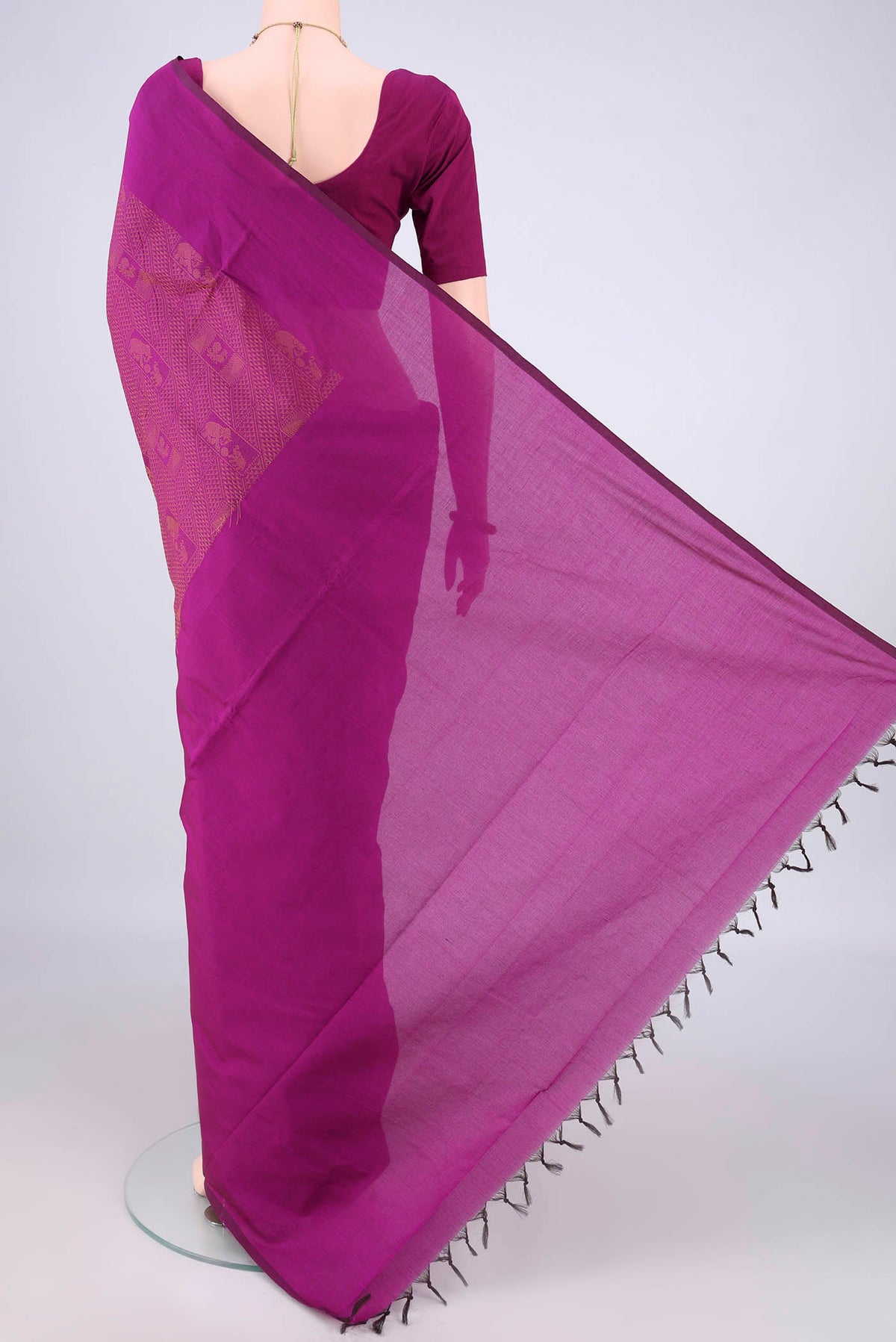 Flat view of Magenta Blended Poly Cotton Saree with Jacquard design on the body and Thread Border. 