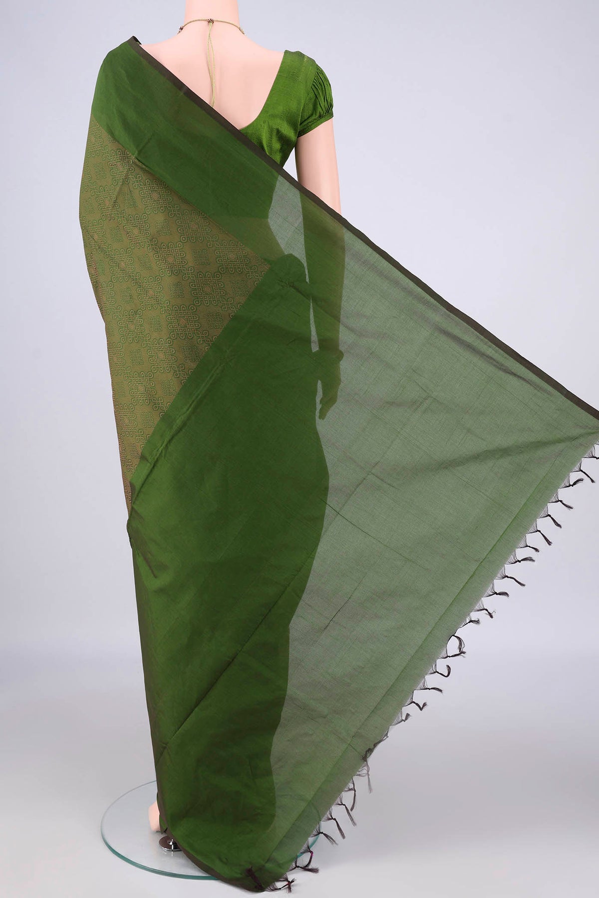 Flat view of Mehandi Green Blended Poly Cotton Saree with Jacquard design on the body and Thread Border. 