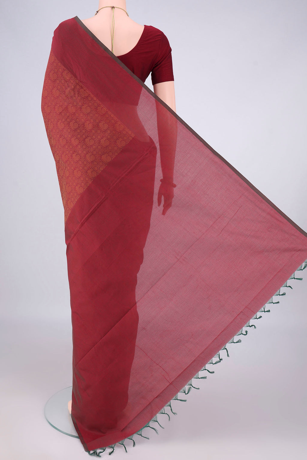 Flat view of Rust Blended Poly Cotton Saree with Jacquard design on the body and Thread Border. 