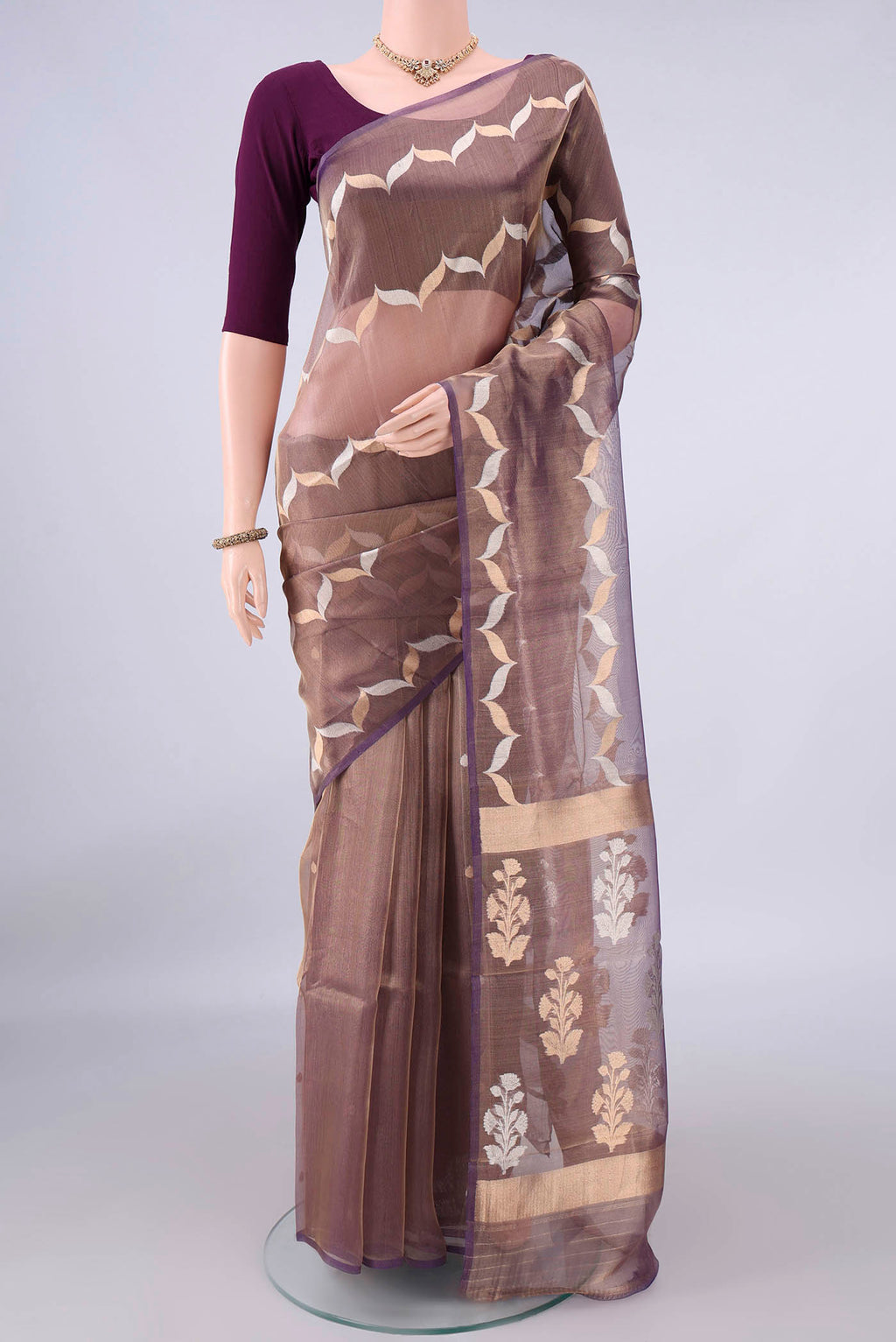 Purple Organza Saree with Fancy on the body and Fancy Border.  displayed on a mannequin