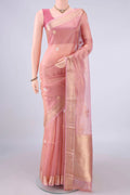 Peach Organza Saree with Zari Butta on the body and Zari Border.  displayed on a mannequin