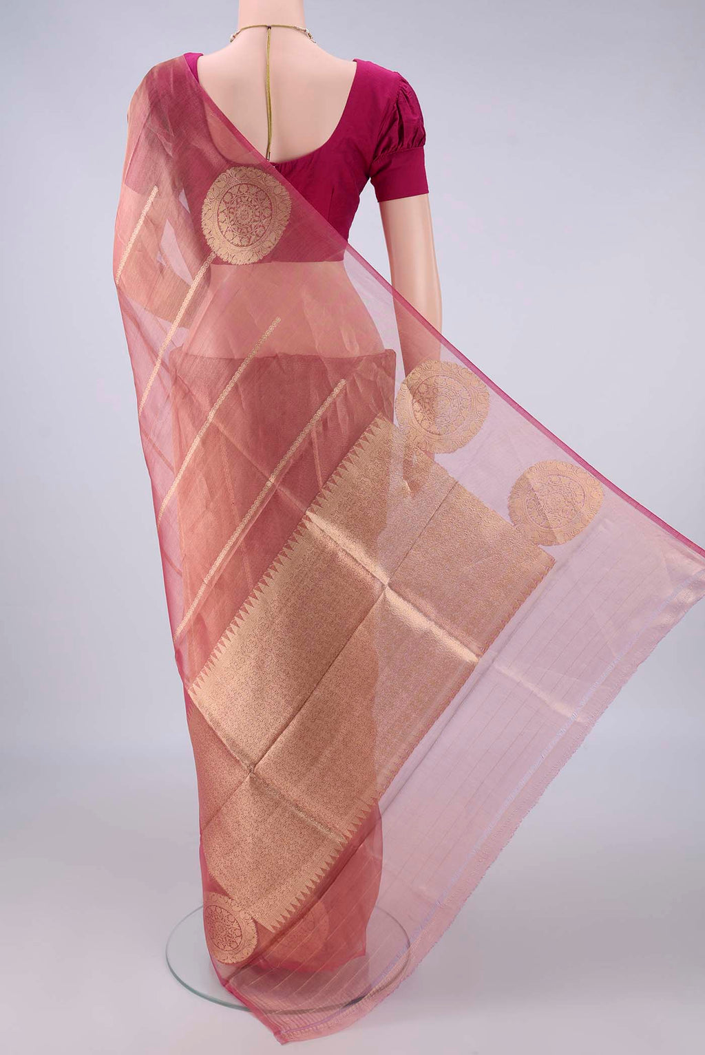 Flat view of Golden Peach Organza Saree with Stripes on the body and Without Border. 