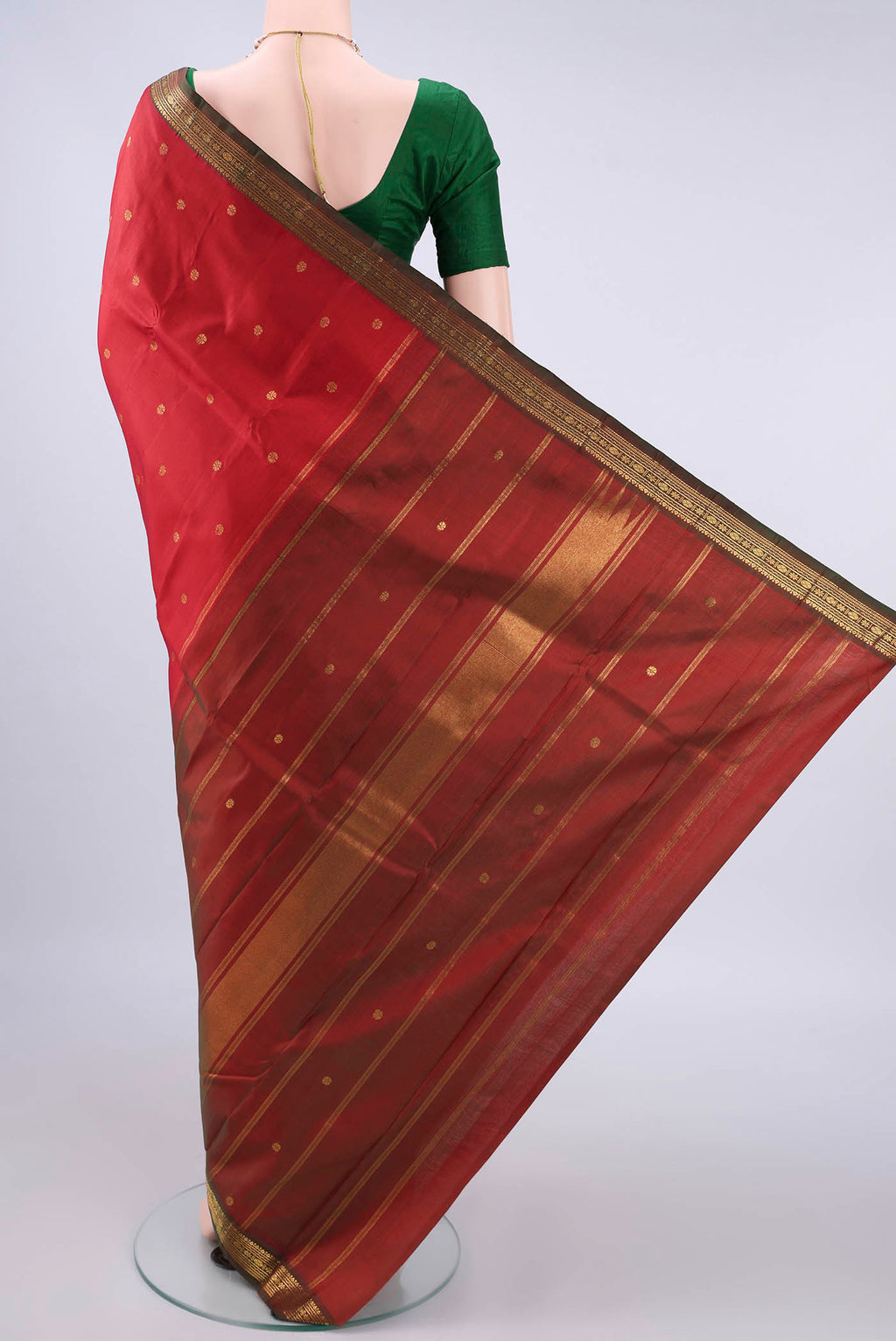Flat view of Pure Silk Red Kanchipuram Saree with Zari Butta on the body and Zari Border. 