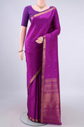 Pure Silk Purple Kanjivaram Saree with Zari Butta on the body and Zari Border.  displayed on a mannequin