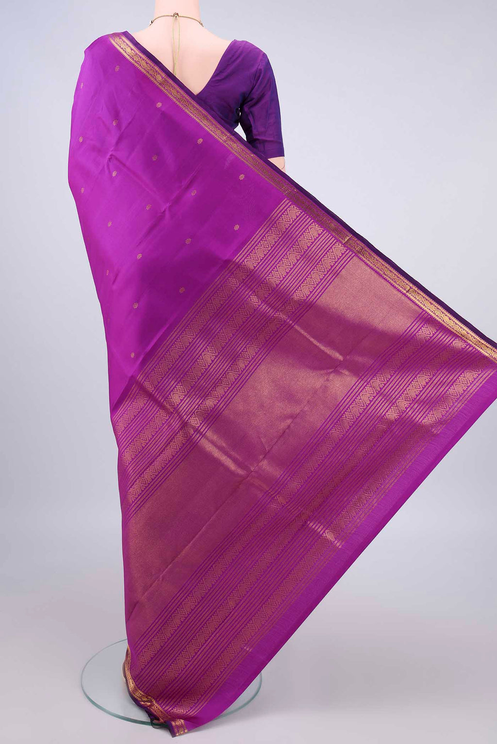 Flat view of Pure Silk Purple Kanjivaram Saree with Zari Butta on the body and Zari Border. 