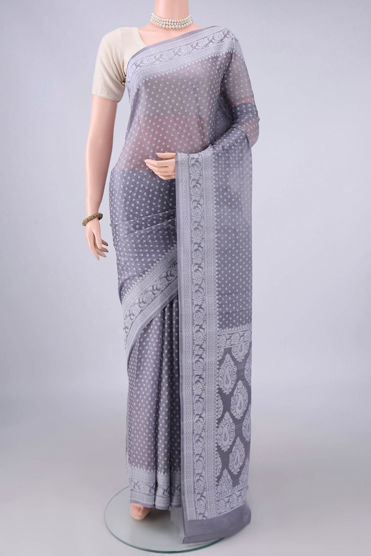 Grey Blended Banarasi Georgette Saree with Thread Butta on the body and Thread Border.  displayed on a mannequin