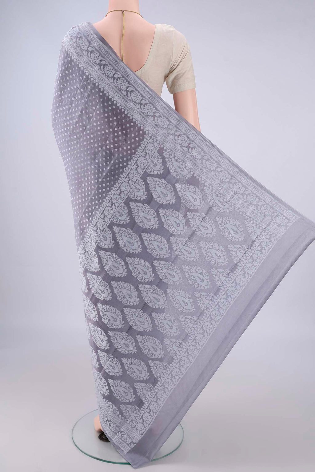 Flat view of Grey Blended Banarasi Georgette Saree with Thread Butta on the body and Thread Border. 