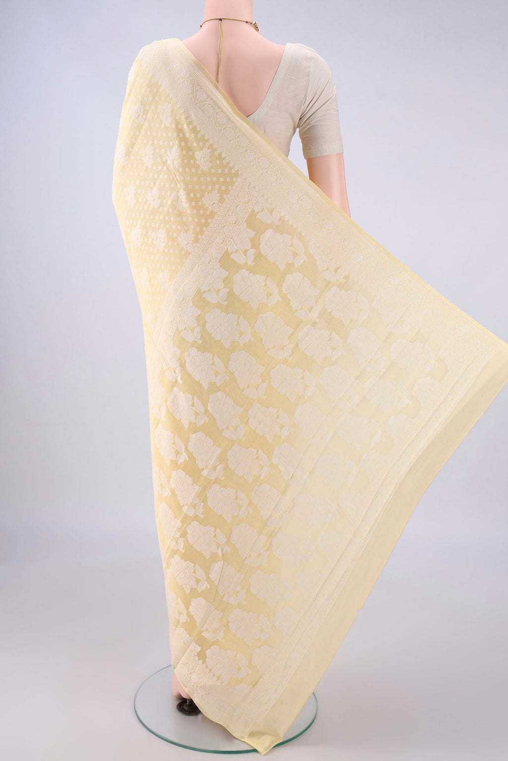 Flat view of Yellow Blended Banarasi Georgette Saree with Thread Brocade on the body and Thread Border. 
