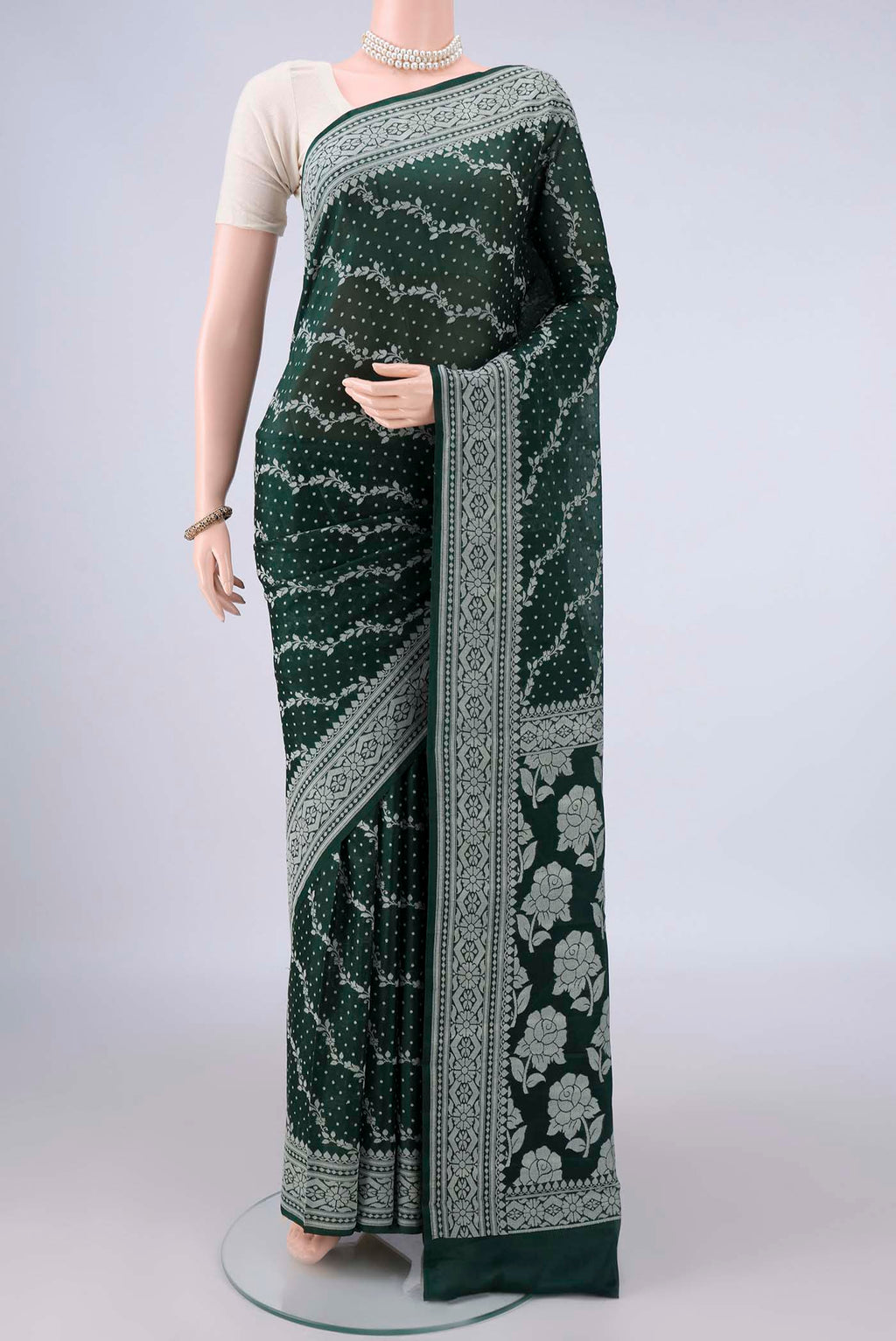 Bottle Green Blended Banarasi Georgette Saree with Thread Butta on the body and Thread Border.  displayed on a mannequin