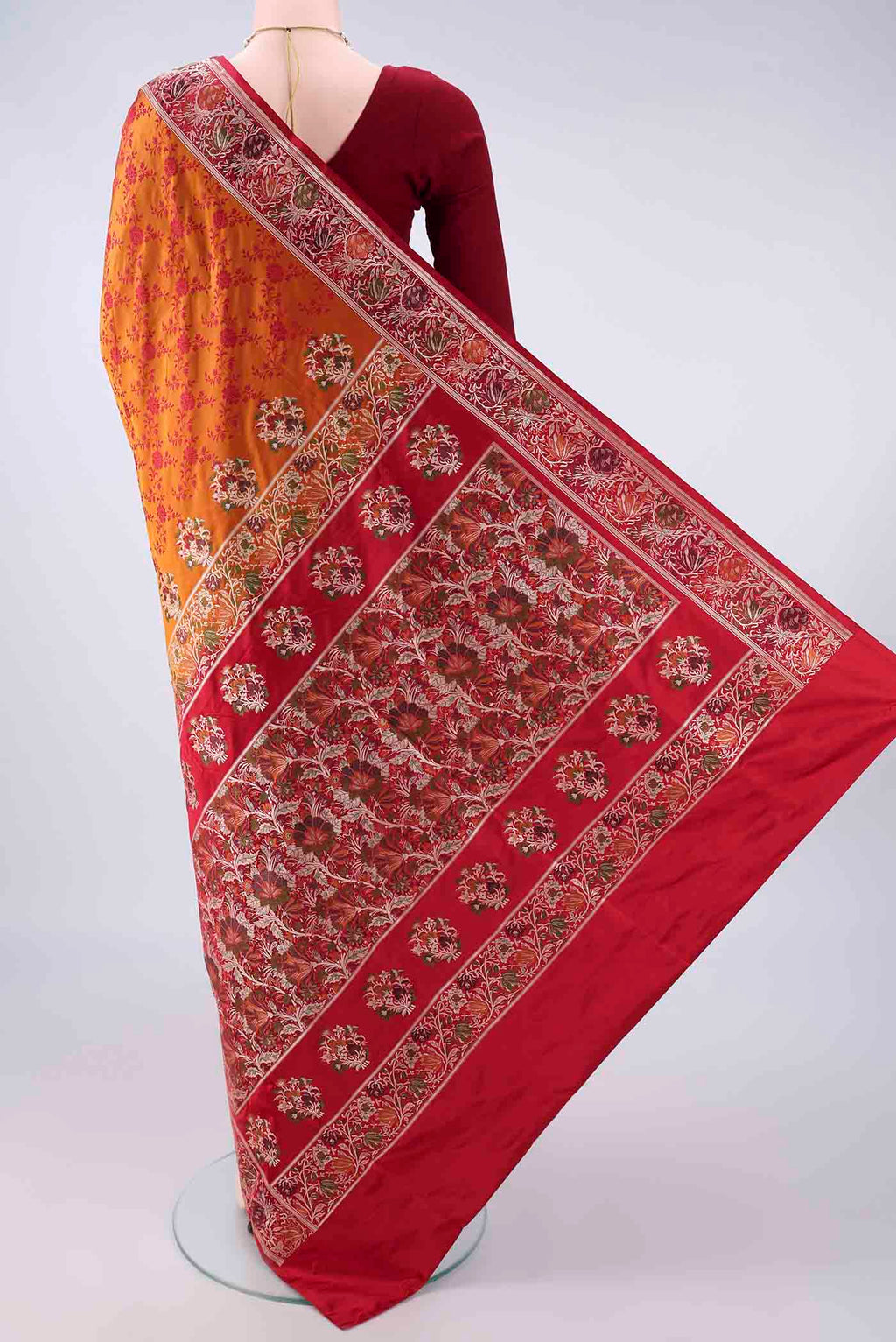 Flat view of Orange Banarasi Jamavar Saree with Thread Brocade on the body and Zari Border. 