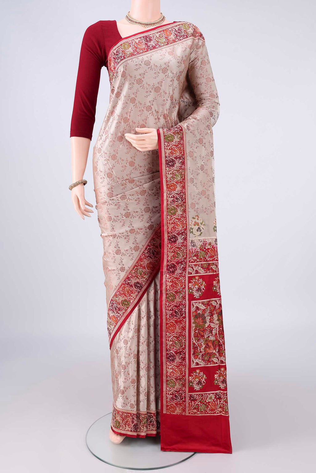 Beige Banarasi Jamavar Saree with Thread Brocade on the body and Zari Border.  displayed on a mannequin