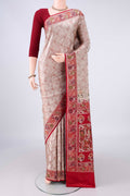 Beige Banarasi Jamavar Saree with Thread Brocade on the body and Zari Border.  displayed on a mannequin