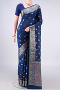 Pure Silk Blue Banarasi Raw Saree with Zari Butta on the body and Zari And Thread Border.  displayed on a mannequin