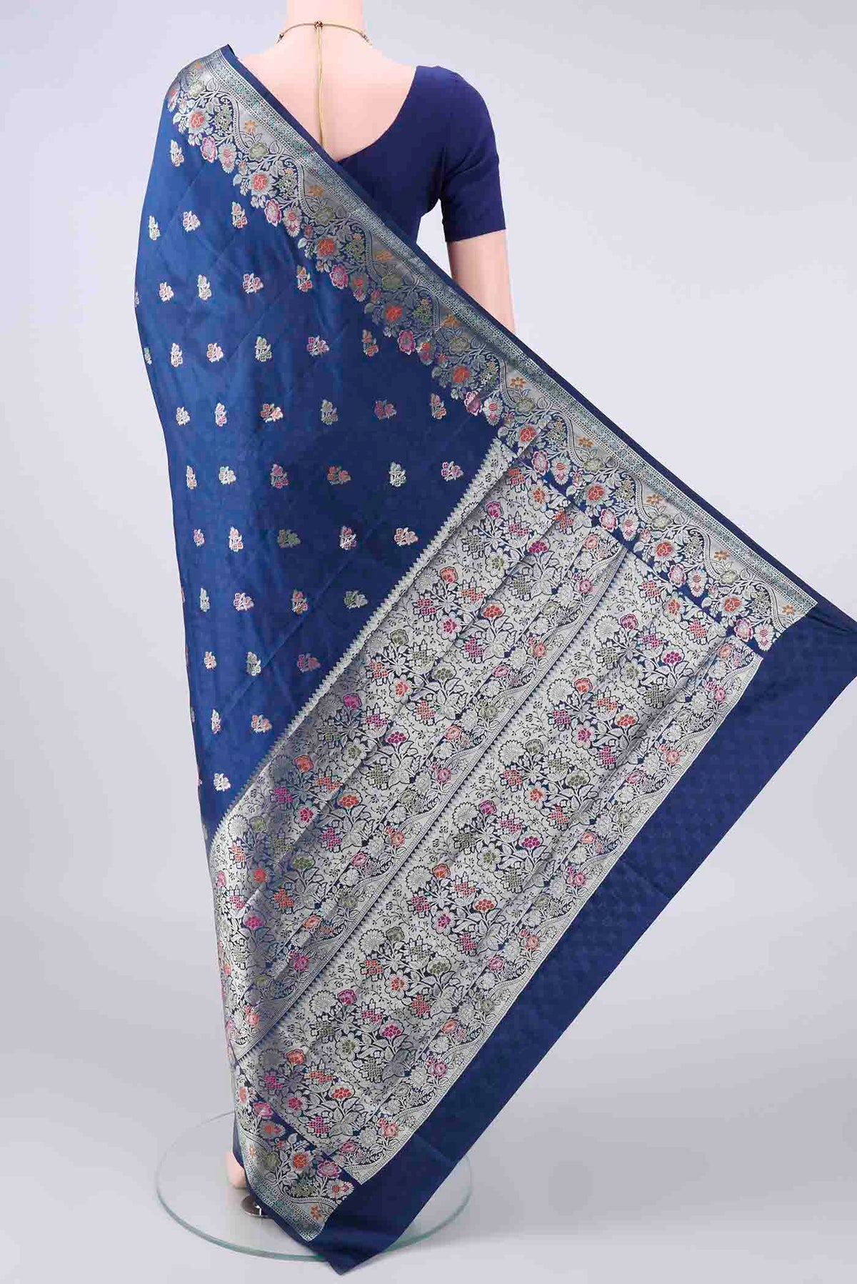 Flat view of Pure Silk Blue Banarasi Raw Saree with Zari Butta on the body and Zari And Thread Border. 