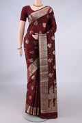 Pure Silk Coffee Brown Banarasi Raw Saree with Zari Butta on the body and Zari And Thread Border.  displayed on a mannequin