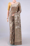 Pure Silk Dark Beige Banarasi Raw Saree with Zari Brocade on the body and Zari And Thread Border.  displayed on a mannequin