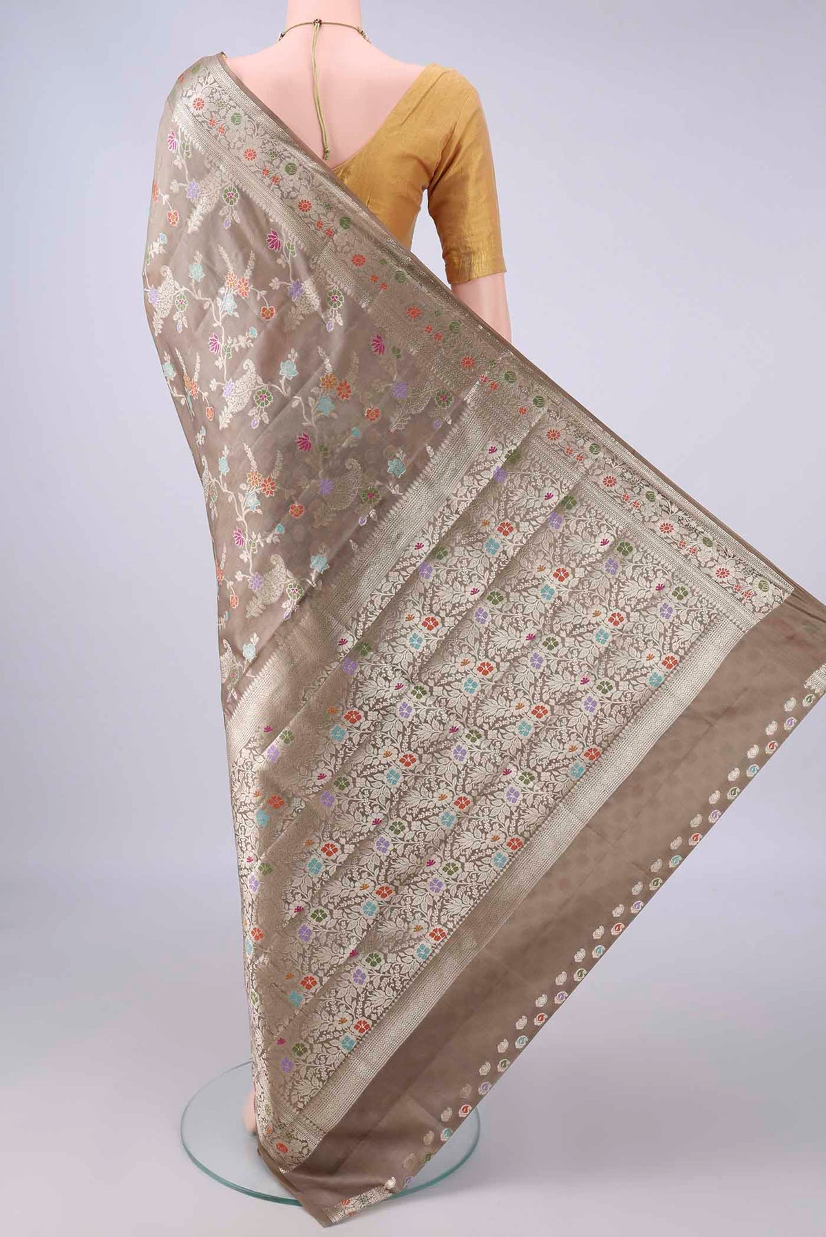 Flat view of Pure Silk Dark Beige Banarasi Raw Saree with Zari Brocade on the body and Zari And Thread Border. 